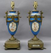 A pair of Sevres-style urns with ormolu mounts (converted to electricity) overall height 38cm