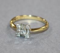 An 18ct gold brilliant and baguette diamond dress ring, size N