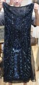 A 1920's petrol blue sequin on black net flapper dress (with later alterations)