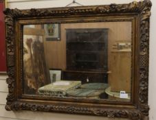 A carved giltwood framed wall mirror W.105cm H.77cm