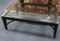 A Porta Romana glass topped coffee table W.111cm