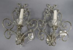 A pair of glass bead and silvered metal two branch wall sconces length 31cm