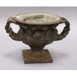 A bronzed cast iron campana form urn height 13cm