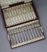 A cased set of twelve pairs of Swedish silver dessert eaters