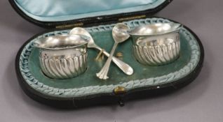 A cased pair of Victorian silver salts and spoons.