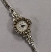 A lady's 18ct white gold and diamond set Rose cocktail watch, on a 9ct white gold snakelink