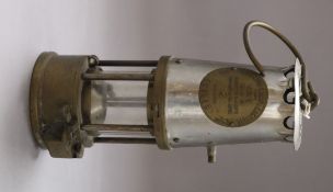 A miner's lamp by the Protector Lamp and Lighting Co Ltd overall height 31cm