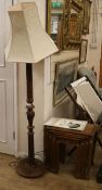 A carved standard lamp and carved set of four graduated side tables tables W.51cm, lamp W.35cm at