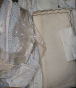 A quantity of crochet and embroidered table linens and lace trimmings