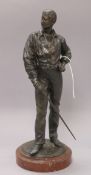 A bronze of a fencer, on marble base height 31cm