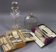 A silver collared glass decanter (af) and one other decanter, a vanity case and cased silver brush &