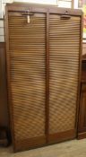 An oak double tambour shutter filing cabinet W.92cm