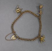 A 9ct gold charm bracelet, hung with three assorted 9ct gold charms.