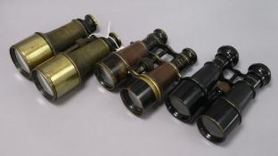 A pair of Naval military binoculars, a similar pair Mark 5 Special binoculars and another pair