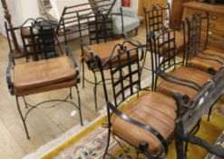 Six iron patio chairs with leather cushions