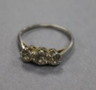 A white metal and three stone diamond ring, size O.