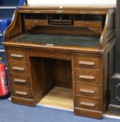 A T. Dobson & Son of Leeds oak tambour top desk W.120cm
