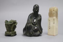 A modern soapstone seal, an 18th century Chinese bronze figure from a censer and a Chinese bronze of