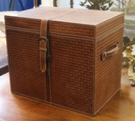 A brown leather chest with securing strap W.46cm
