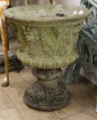 A reconstituted stone garden urn W.53cm