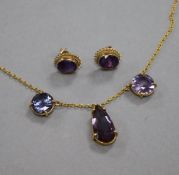 A 9ct gold and gem set necklace and pair of earrings.