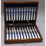 A set of twelve late Victorian plated engraved dessert knives and forks, with mother of pearl pistol