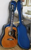 An EKO 12 string acoustic guitar and case