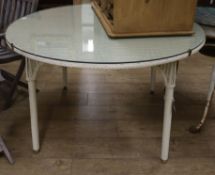 A Lloyd Loom dining table with glass top W.120cm