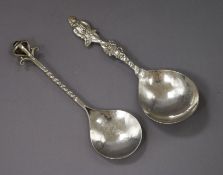 An Arts and Crafts silver caddy spoon with cabochon terminal and a Dutch imported silver spoon.