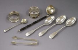 A group of small silver including two serviette rings, salt spoon, a pair of sugar tongs, a silver