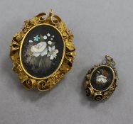 A Victorian yellow metal and pietra dura oval pendant brooch and a pietra dura pendant, largest