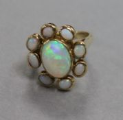 A 9ct gold and nine stone white opal cluster ring, size N.