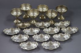 A set of six planished sterling silver pedestal dishes and a set set of ten sterling silver small