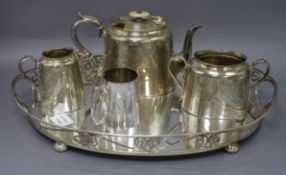 A plated engraved three piece teaset together with an oval plated tea tray tray length 49.5cm (4)