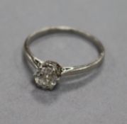 A platinum and solitaire round cut diamond ring, size L.