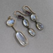 A yellow metal and moonstone drop pendant and a pair of drop earrings.