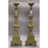 A pair of brass pricket candlesticks height 64cm