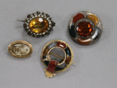 Two late 19th century Scottish hardstone brooches, a citrine and seed pearl brooch and an early 19th