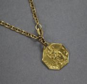 A yellow metal St. Christophers pendant on an 18ct gold chain.