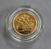 A 1980 gold half proof sovereign.