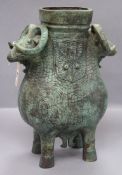 A double ram's head copper zun/ritual wine vessel, after the Shang dynasty original in the British