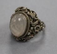 An Austro-Hungarian? white metal and carved cabochon set poison ring, size R.