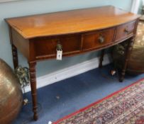 A Regency inlaid mahogany bow-fronted side table, fitted three short drawers on turned supports W.