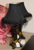 A pair of small table lamps with black shades