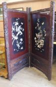 A Japanese shibayama work two fold screen, each panel with oblong reserve depicting a bird of prey