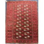 A red ground rug 132 x 102cm