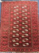 A red ground rug 132 x 102cm