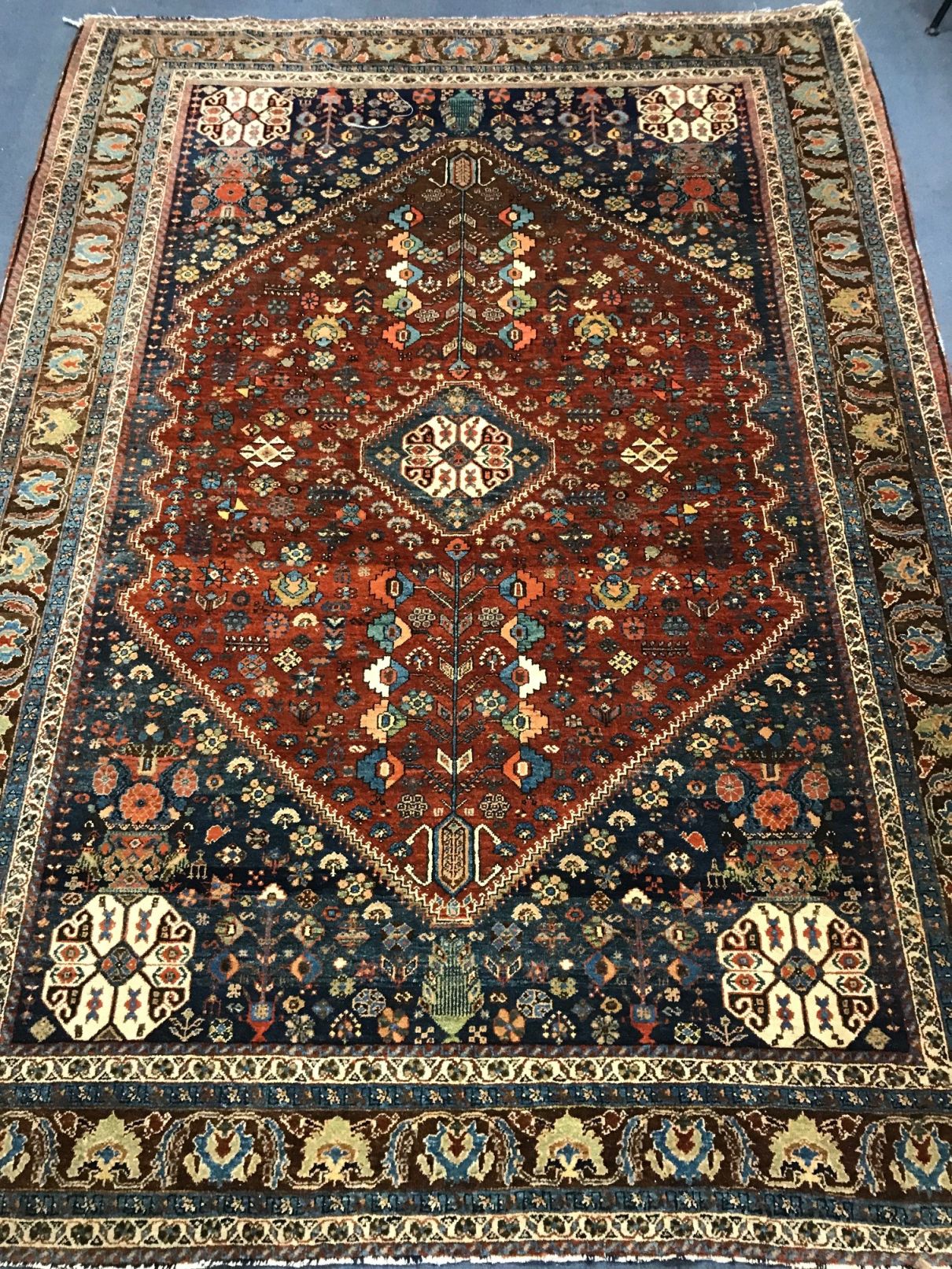 A Persian blue ground carpet 215cm x 155cm