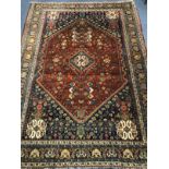 A Persian blue ground carpet 215cm x 155cm