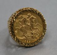 A George V 1925 gold full sovereign ring, in 9ct gold mount, size Q.